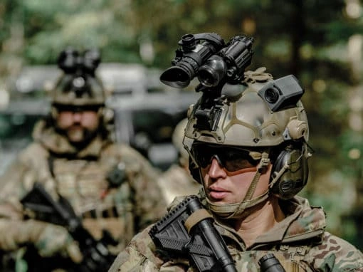 Law enforcement officer wearing tactical headset and helmet